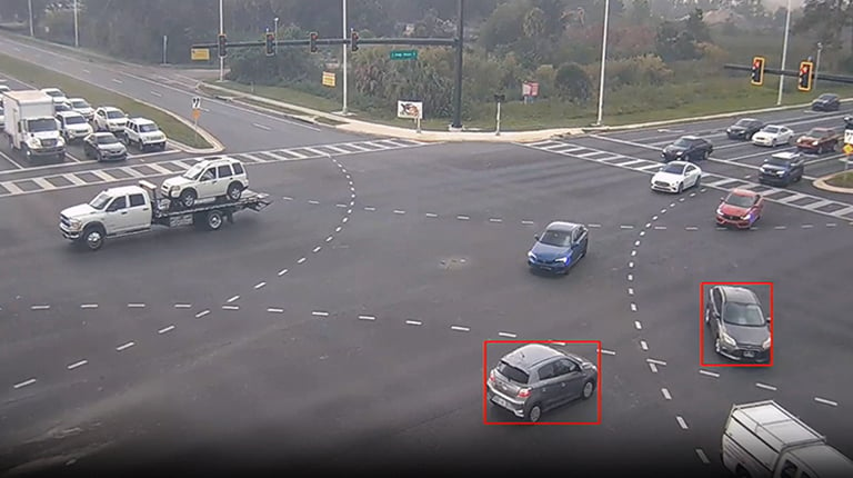 An aerial view of a near-miss detected within a roadway intersection