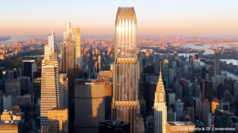 Tall building gleaming in sunlight against a clear sky.