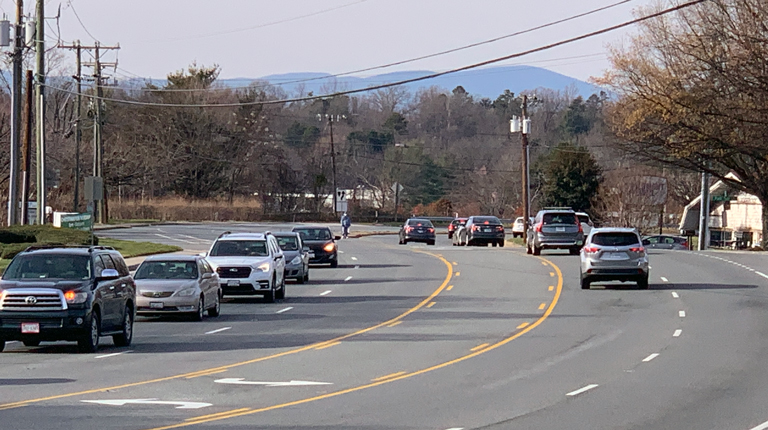 A high-risk corridor with high volumes of cars and multi-lanes, in need of pedestrian facilities.
