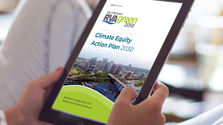 A woman reads the front cover of the Climate Equity Action Plan 2030 on her tablet.