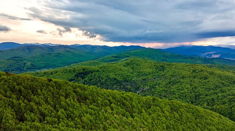 Rolling green mountains and blue skies.