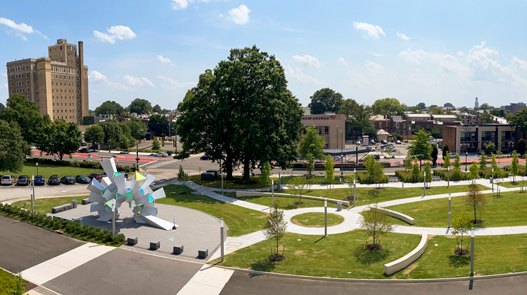 Aerial view of The Green with meandering pathways and sculpture plaza.