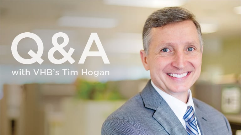 Tim Hogan smiling in an office.