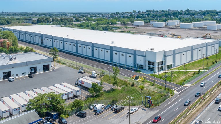 Oblique aerial of Trident Logistics Center, a 367,000-square-foot speculative warehouse, on a sunny day with blue skies.