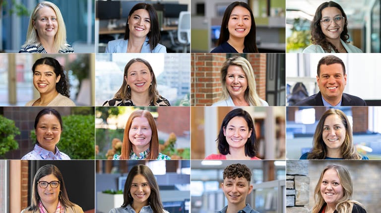 Sixteen VHB employees smiling at the camera.