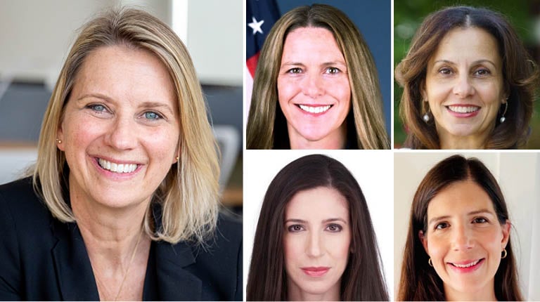 Five women smiling at the camera.