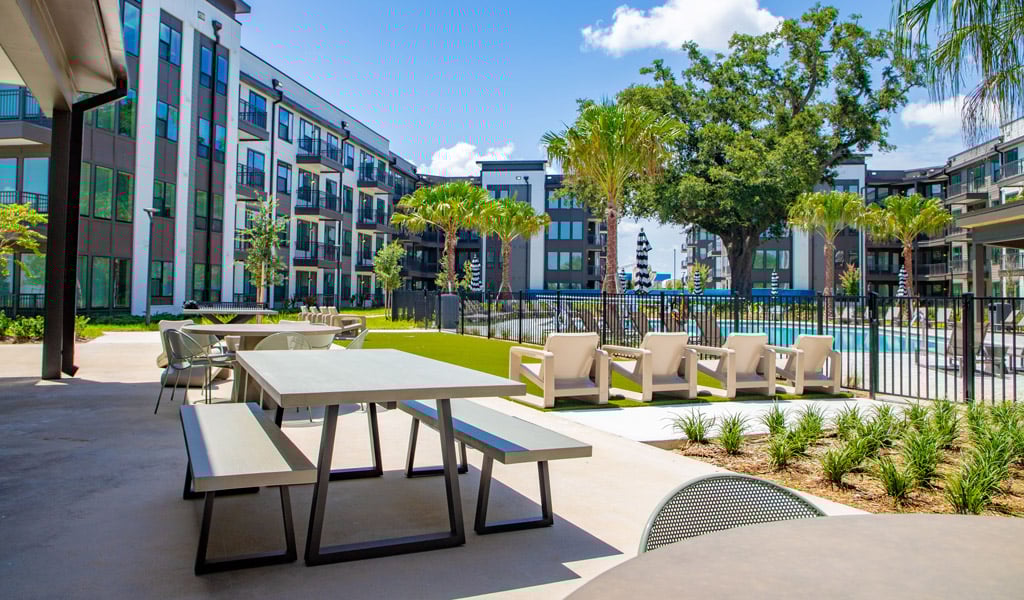 Outside the pool area of a modern apartment building.