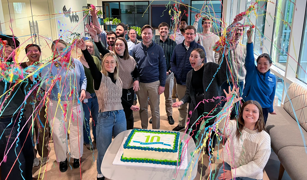 Group of VHBers celebrating with cake and confetti.