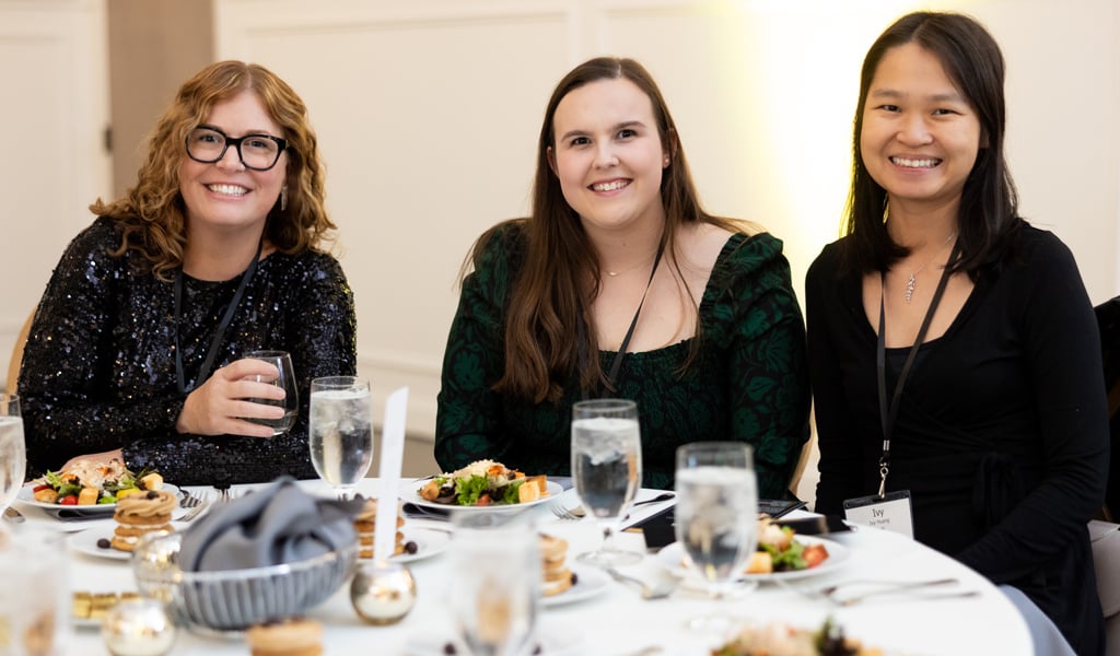 Miranda Salzler, Leah Britt, and Ivy Huang attend the awards ceremony.