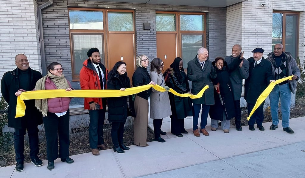 Project partners cut the ribbon in front of Alafia, celebrating the building’s opening.