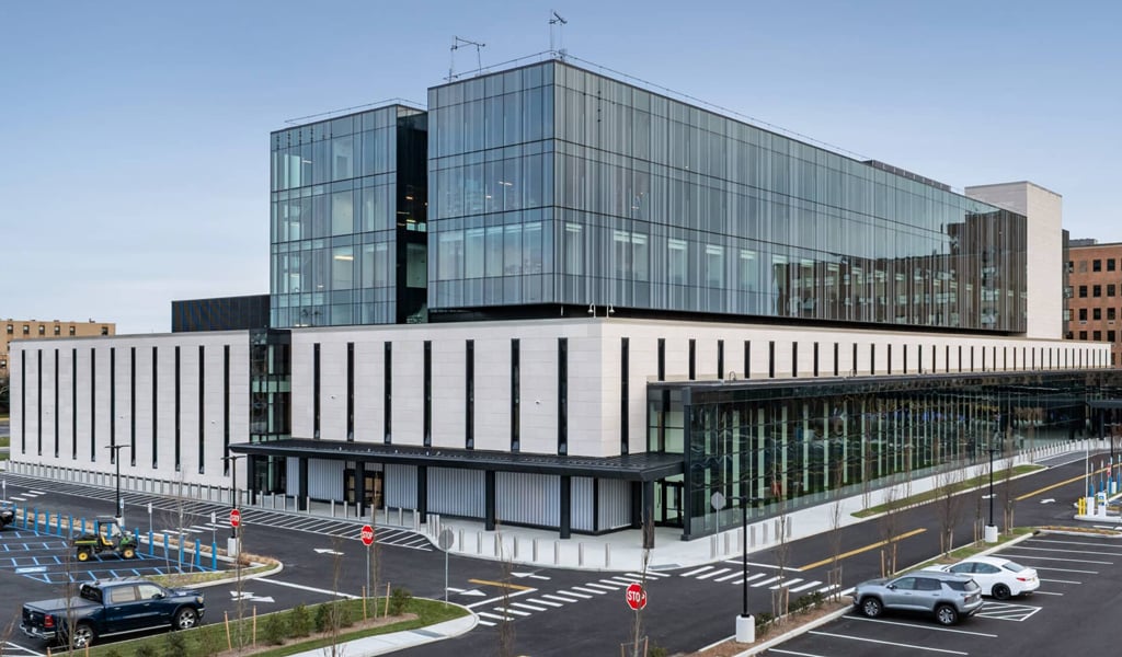 Good Samaritan University Hospital Patient Care Pavilion with adjacent parking, circulation roads, and connected campus buildings.