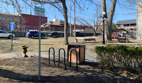 A bike rack in the middle of a park.