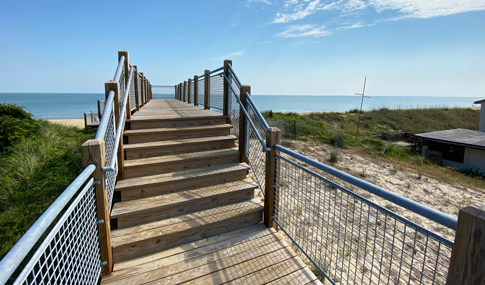 Stairs of the boardwalk constructed up and over the dunes.