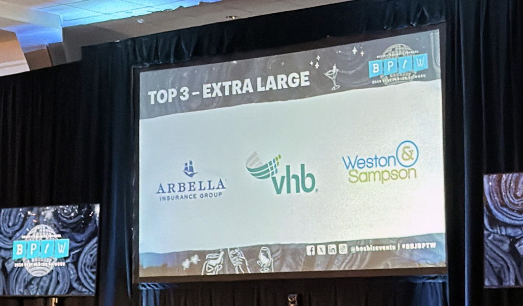 A presentation screen displaying the "Top 3 - Extra Large" category.  The screen features logos for Arbella Insurance Group, VHB, and Weston & Sampson.