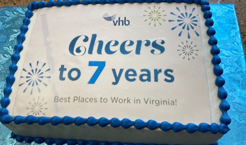 A sheet cake with the text, “Cheers to 7 years.”