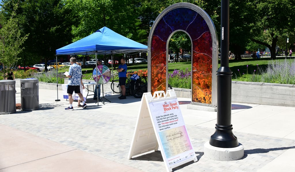 Signage along walkway with structure.