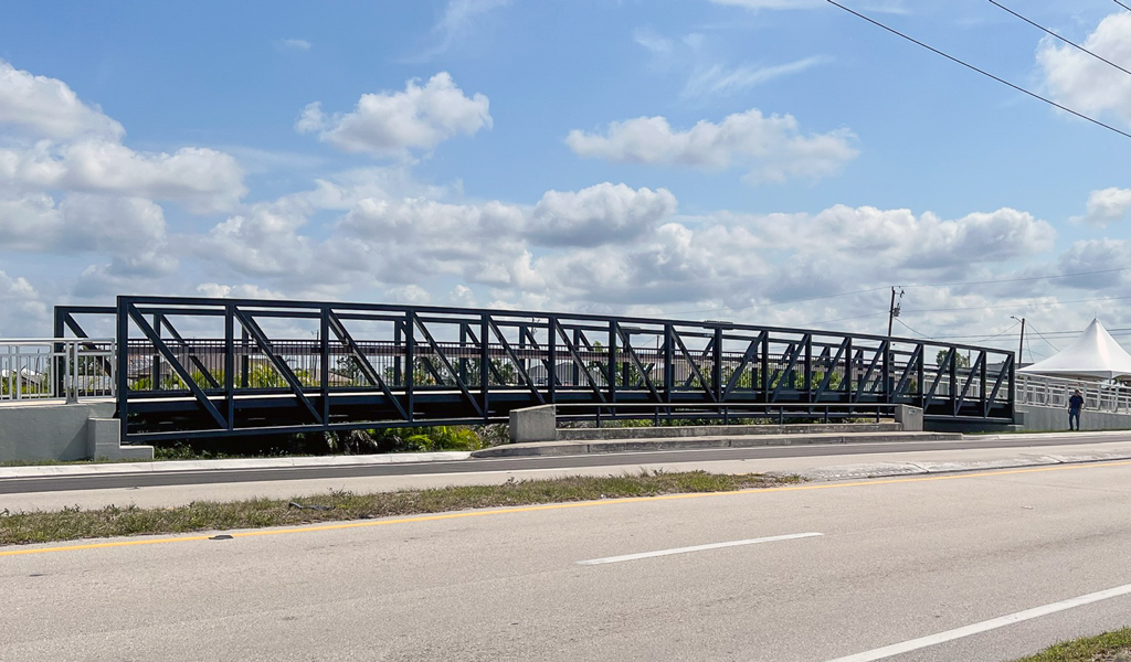 A pedestrian bridge near a busy roadway