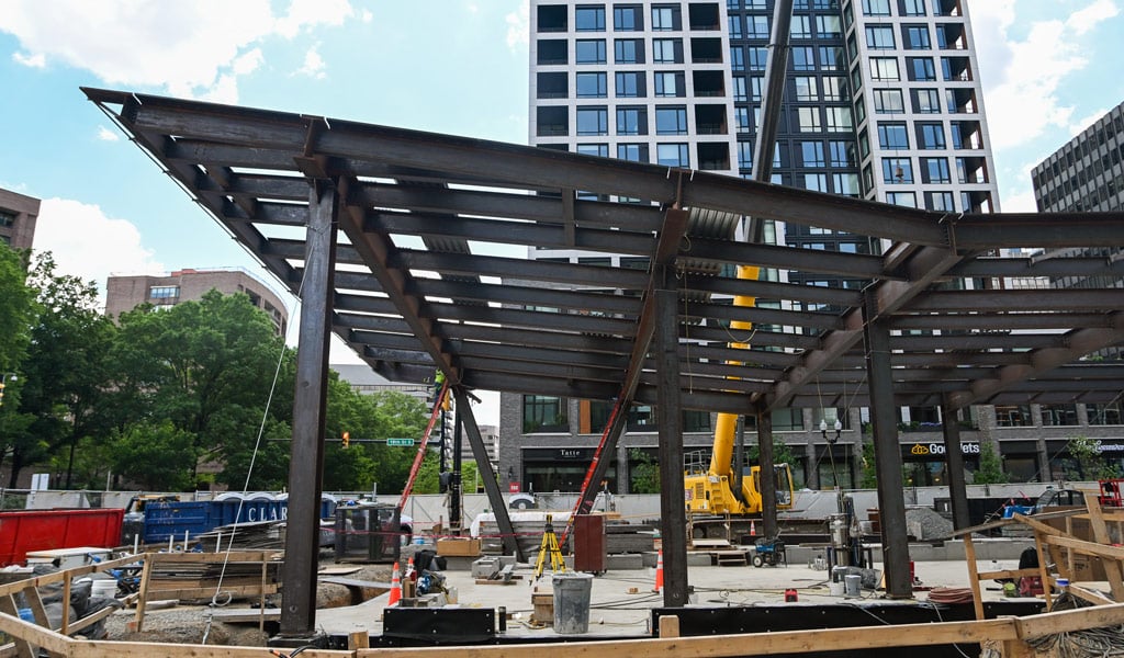 Steel canopy structure under construction at the Crystal City East Entrance during the April 2026 topping out milestone.