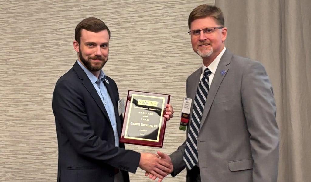 Charlie Townsend shakes hands with PENC President, Brian Johnson.