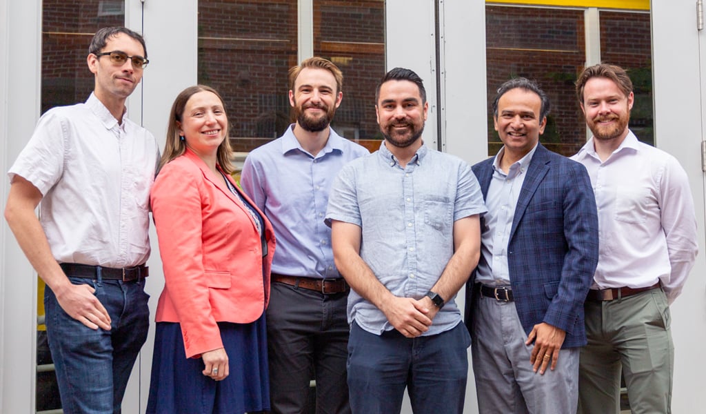 VHB team members smile together for a group photo.