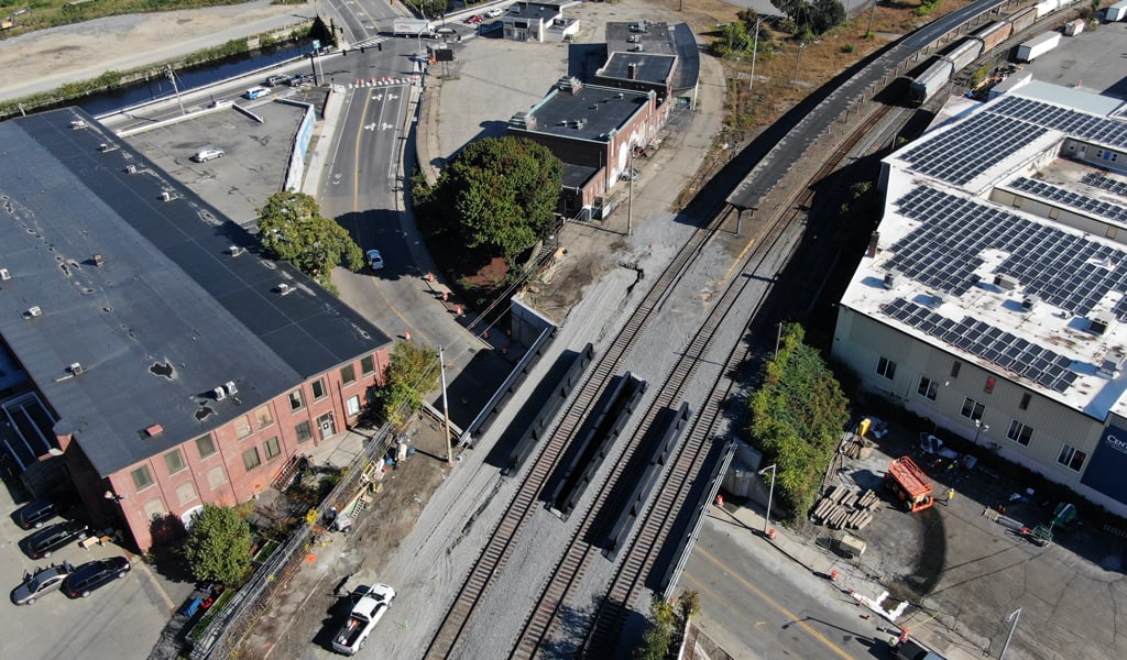 Aerial view of a railway yard with several train tracks and a few trains.  