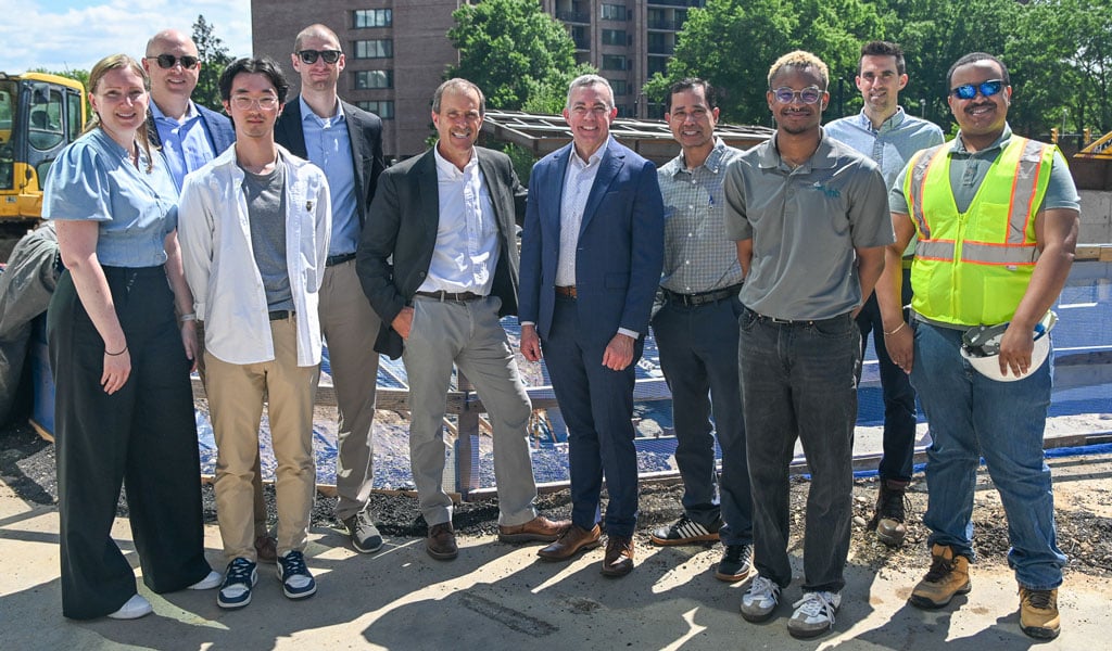 A group of ten VHBers stand together to smile for a group photo. 
