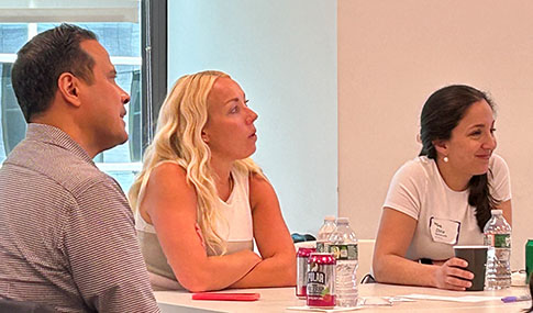 Participants sitting watching a presentation