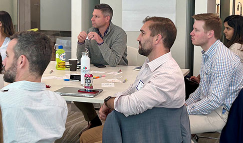 Participants sitting watching a presentation