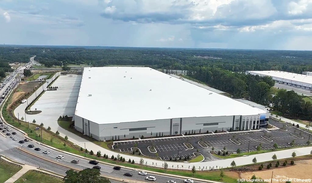 Birds eye perspective of Living Spaces Distribution Facility in Buford, Georgia depicting the parking field and loading docks
