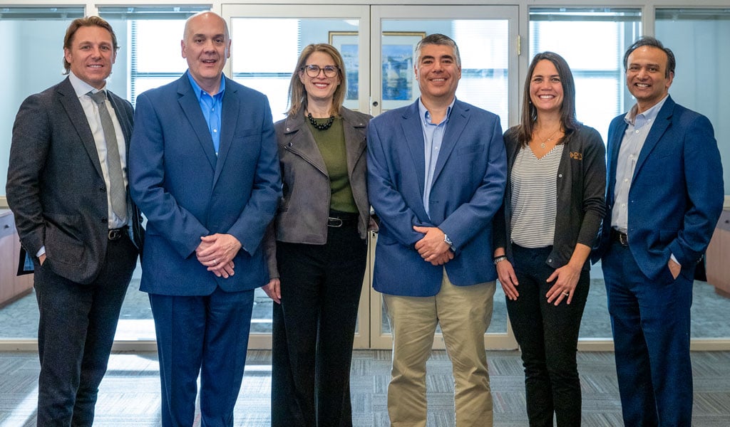 Group of VHB and Drive employees smiling together.