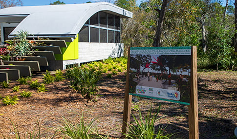 A sign by a garden building