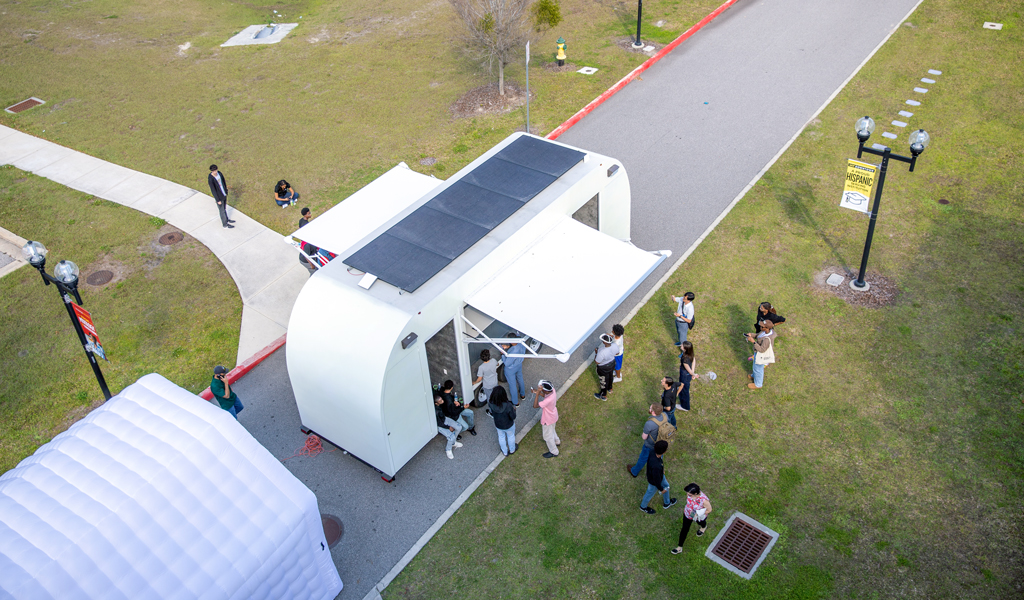 An aerial shot of the solar panels on a resiliency mobile unit in a park.