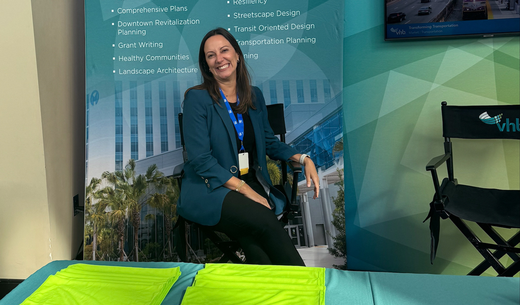 Roberta Fennessy smiles at a VHB conference booth.