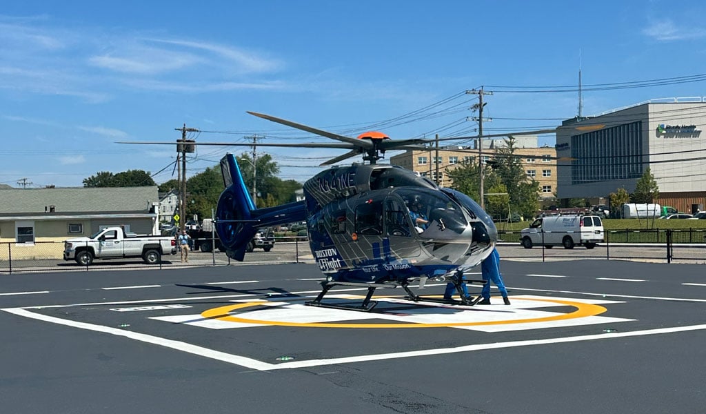 Helicopter landing on new temporary helipad at the hospital.