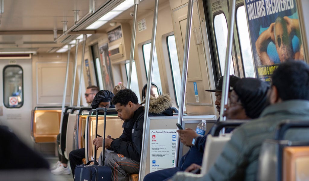 People inside the MARTA train, sitting and riding to their next destination. 
