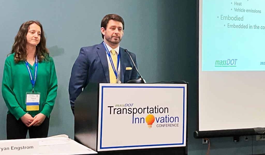 Ken Donald alongside a woman co-presenting an 'Understanding Carbon’ slide.