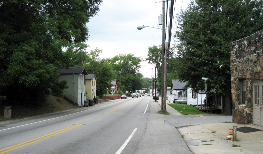 Historic buildings on the side of a rural road.