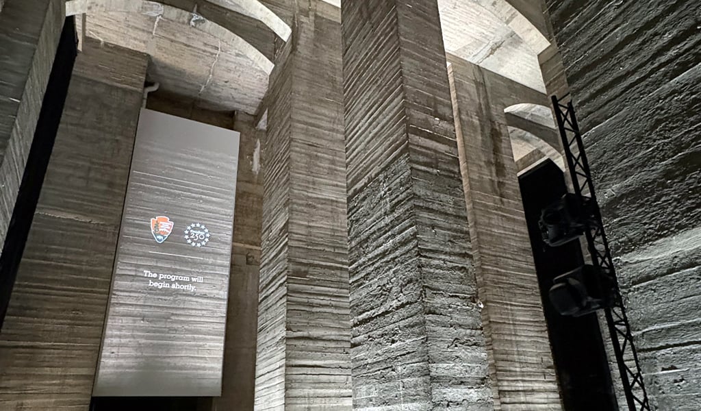 Tall concrete foundation pillars are highlighted and used for interactive projections.  
