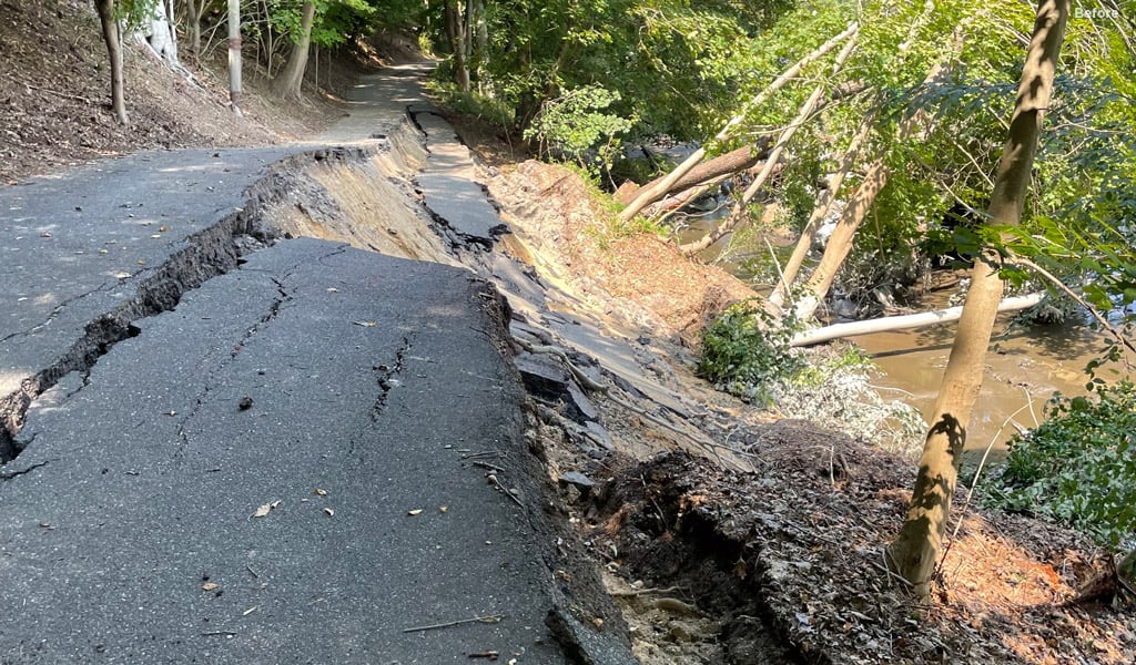Road collapsed near waterfront.