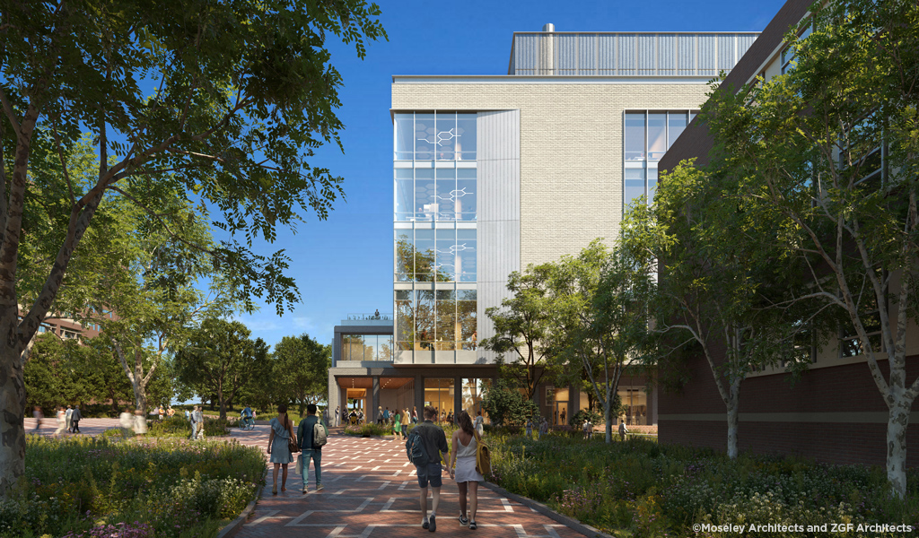 An exterior view of the new building surrounded by students moving through campus.