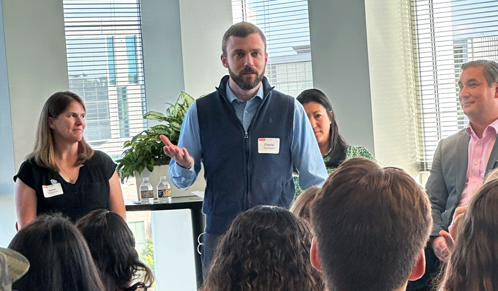 Charlie Townsend stands up to welcome the crowd to the event. 