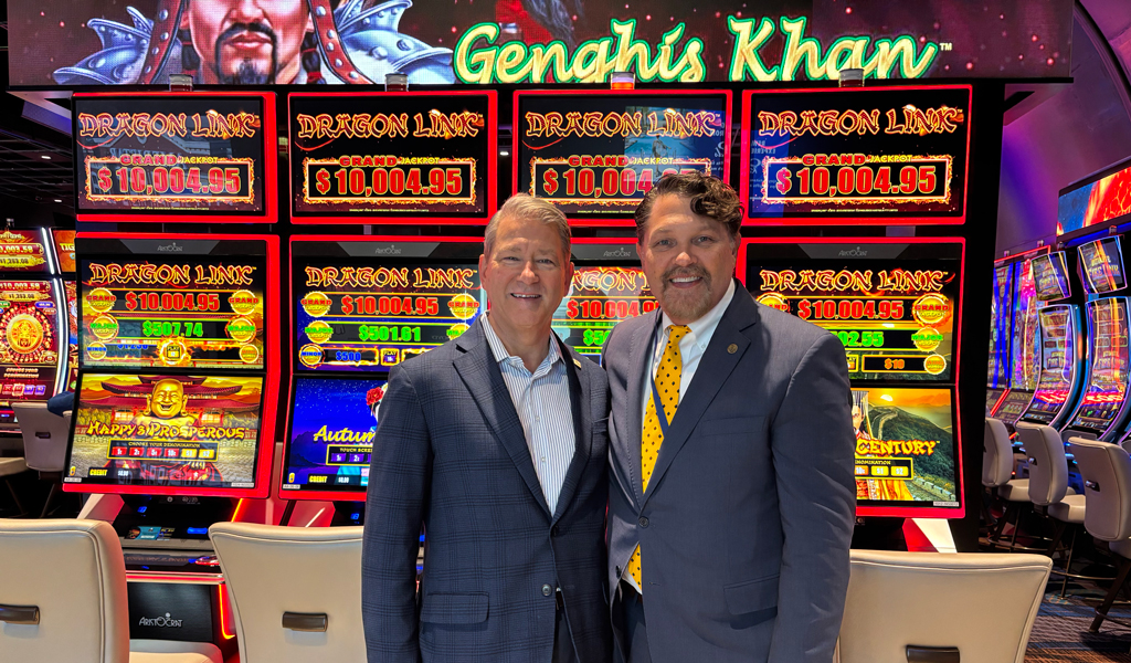Ken Rodman and Kevin Krigsvold inside The Interim Gaming Hall in Norfolk with slot machines in the background
