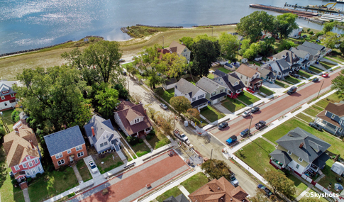 Aerial view of the permeable pavers on Marlboro Boulevard with a row of homes  and the Elizabeth River in the background.