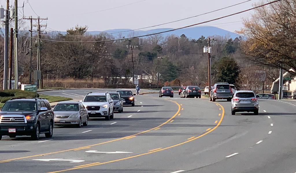 A high-risk corridor with high volumes of cars and multi-lanes, in need of pedestrian facilities.