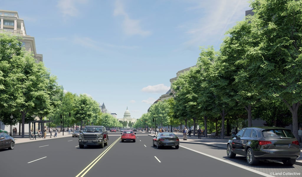 Corridor with rows of trees framing a multi-lane street, vehicles, and the U.S. Capitol in the distance.