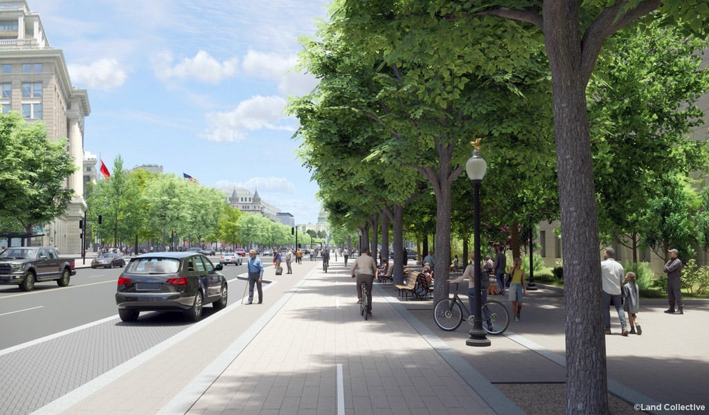 Shaded streetscape with a protected bike lane and wide sidewalk, cyclists and pedestrians move alongside cars.