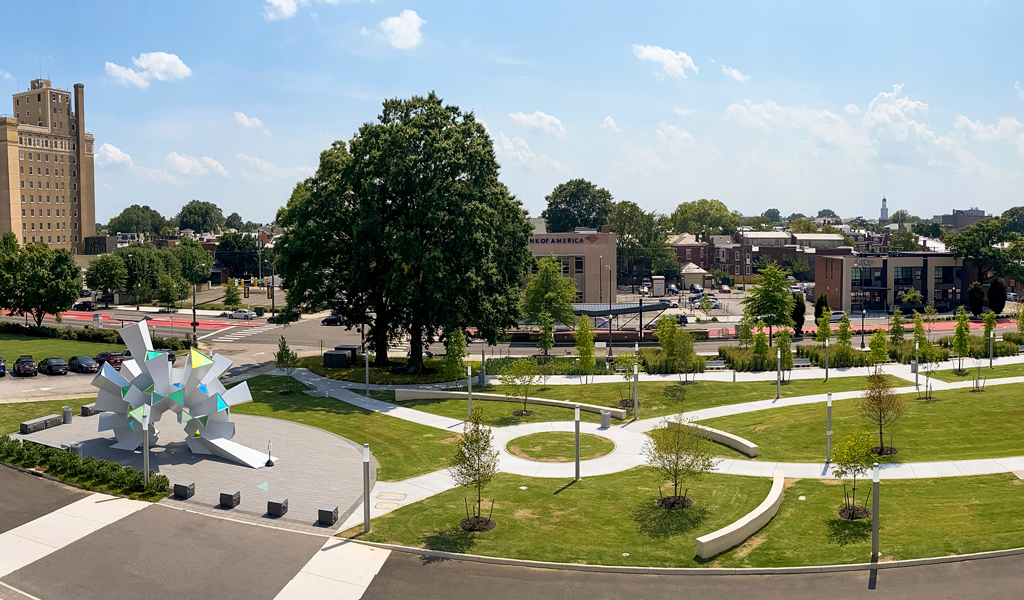 Aerial view of The Green with meandering pathways and sculpture plaza.