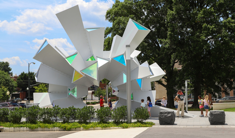 Visitors interact with the “Cosmic Perception” sculpture. 
