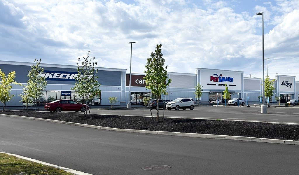 View of shops and parking area at the Springfield Crossing mall.