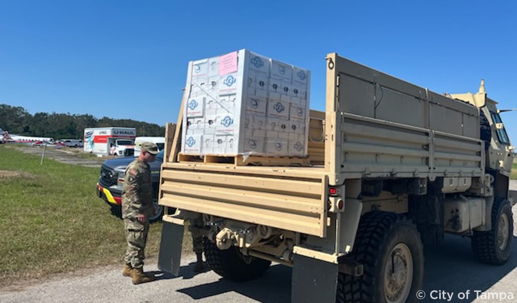Relief supplies loaded on the back of a truck.